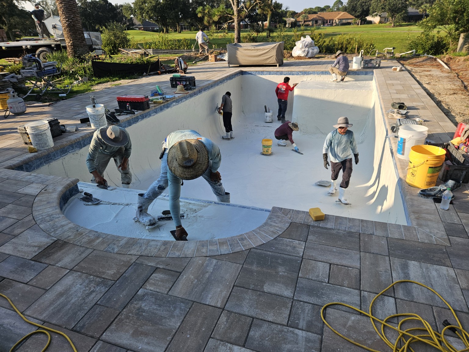 Clean interior finish before filling custom pool